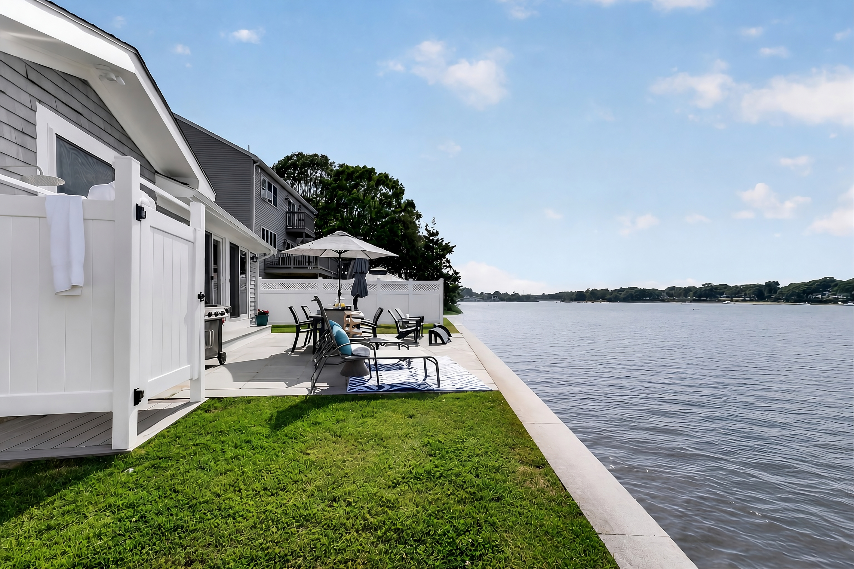 Take in the peaceful waterfront scenery from the home's outdoor spaces.