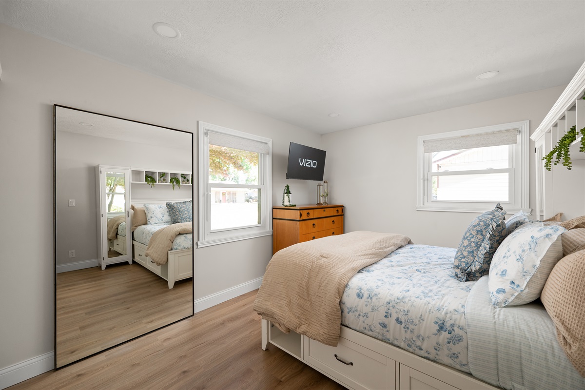 Bedroom #2 features a comfortable queen size bed and Smart TV, creating a cozy space to relax and unwind during your stay.