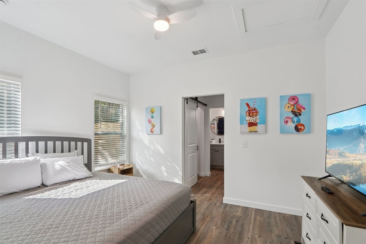 Primary Bedroom has King Bed with Twin Trundle underneath, pack n' play in closet, full en-suite bathroom, 2 closets, Smart TV