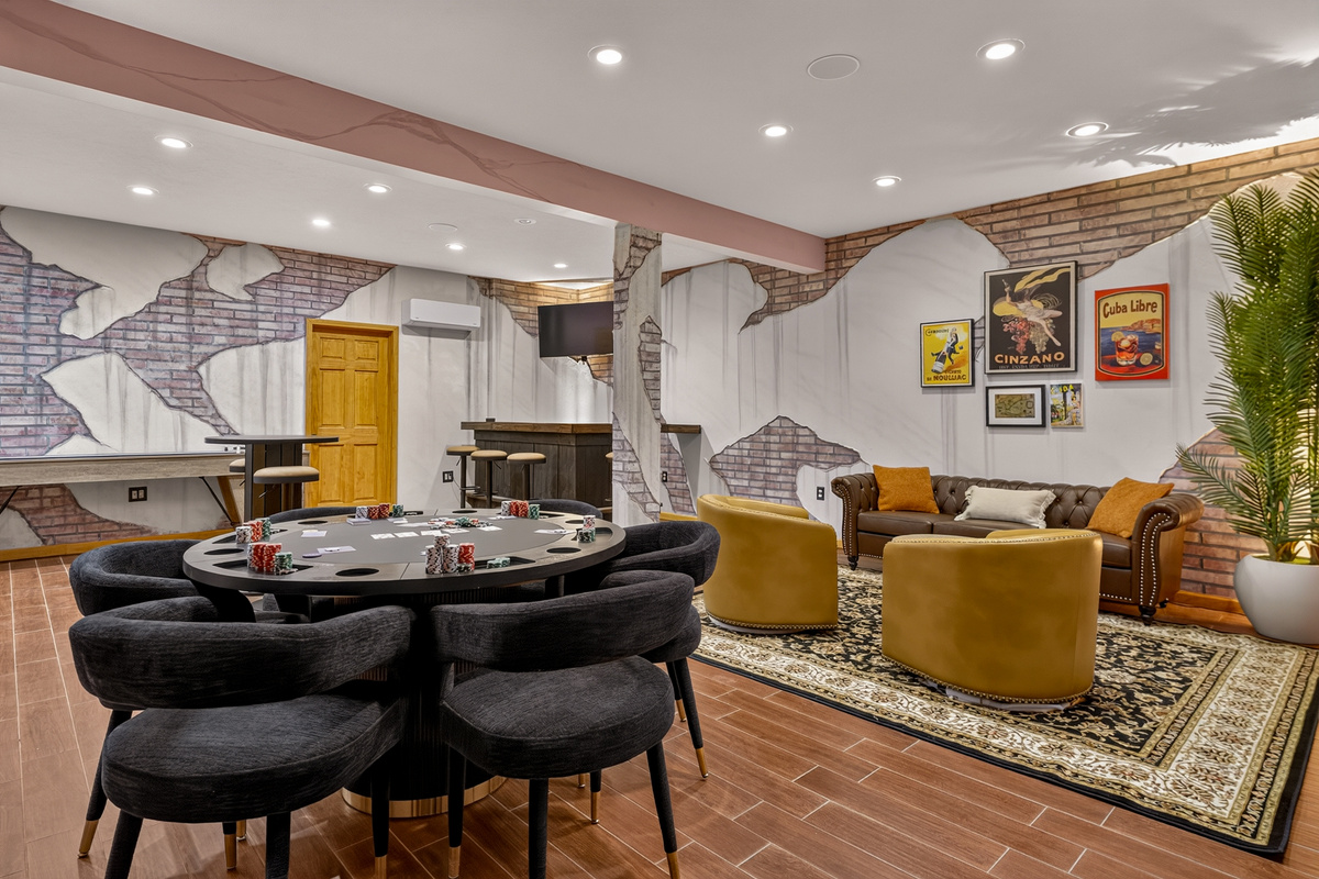 Poker table and lounge seating in entertainment area