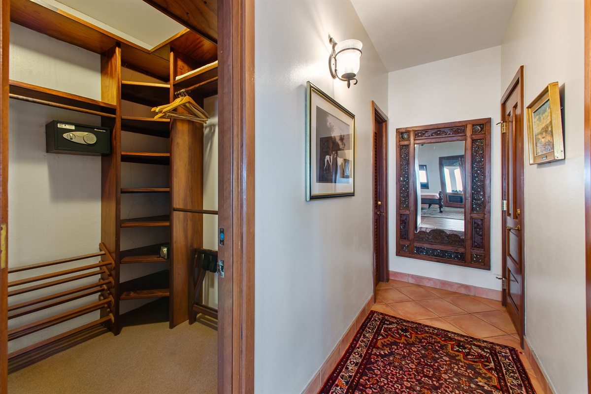 Hallway from the bedroom to the two primary bathrooms.