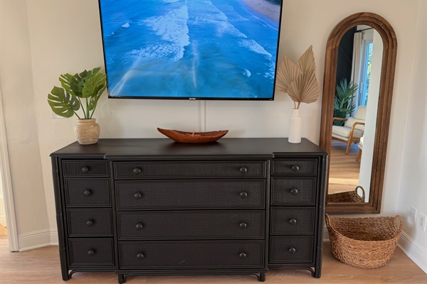 Upper floor primary bedroom with large smart TV