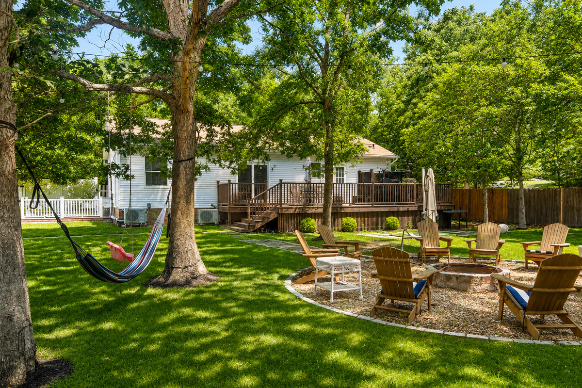 Firepit lounge with hammocks and Adirondack chairs