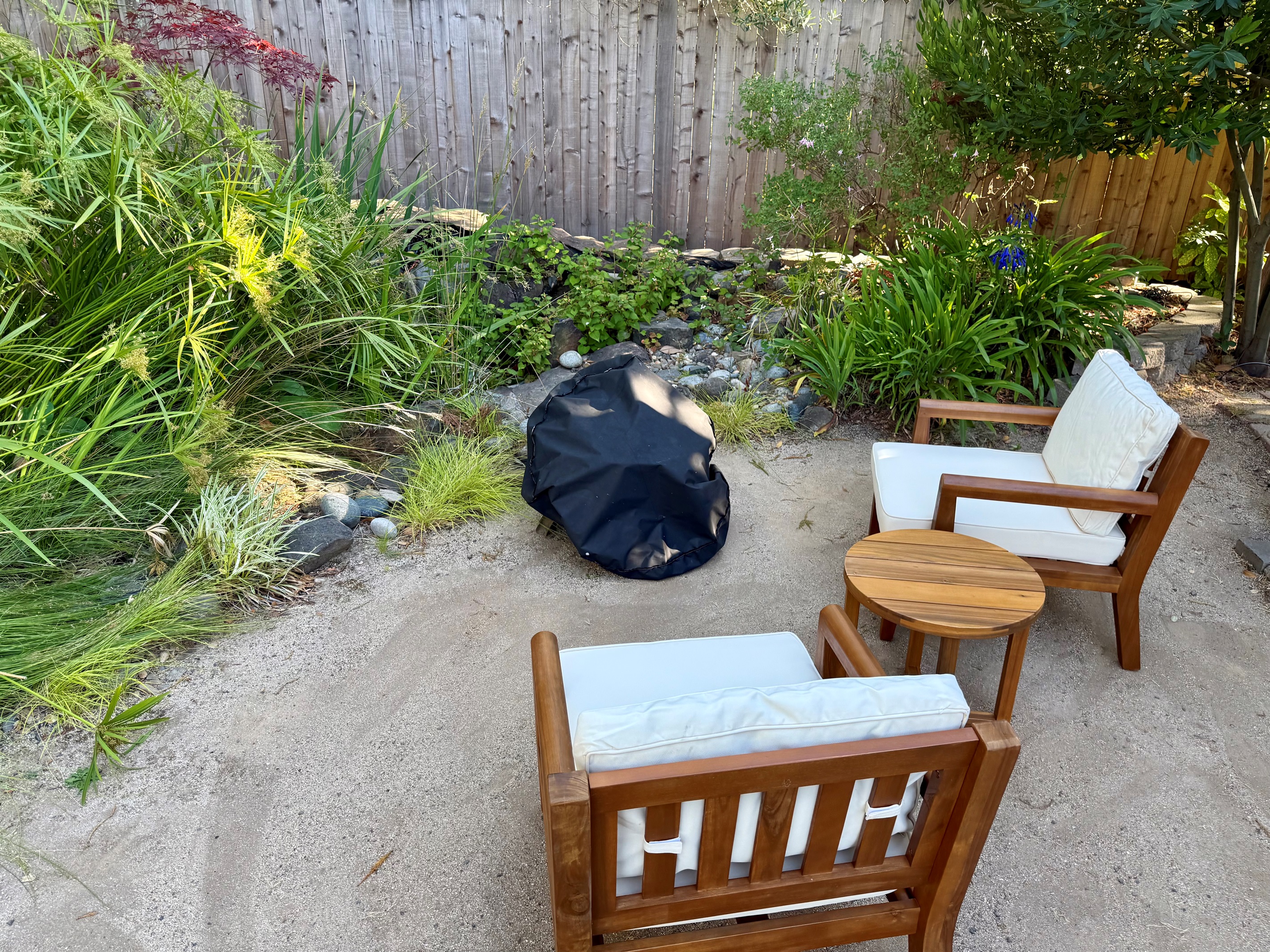 Cozy patio nook w/ chairs & firepit for easy outdoor hangs