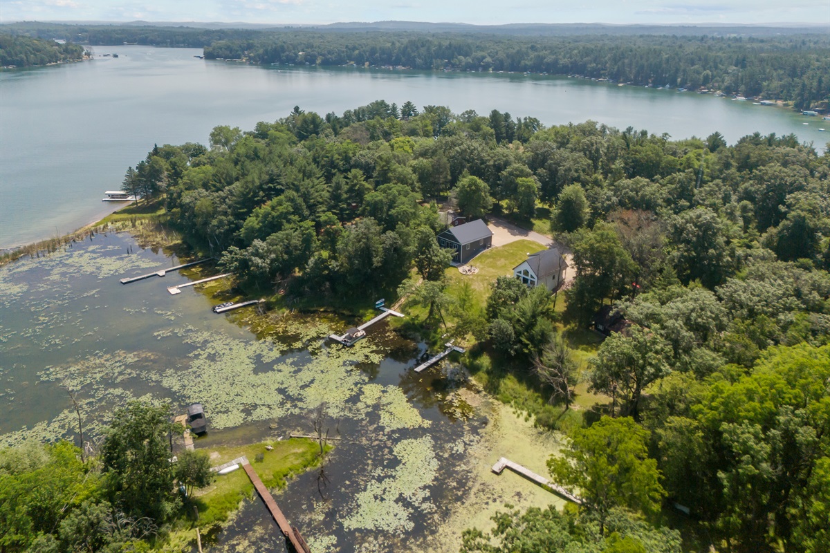 A bird’s-eye view of beautiful Long Lake in Waupaca—see the home, shoreline, and stunning lake setting all in one shot.
