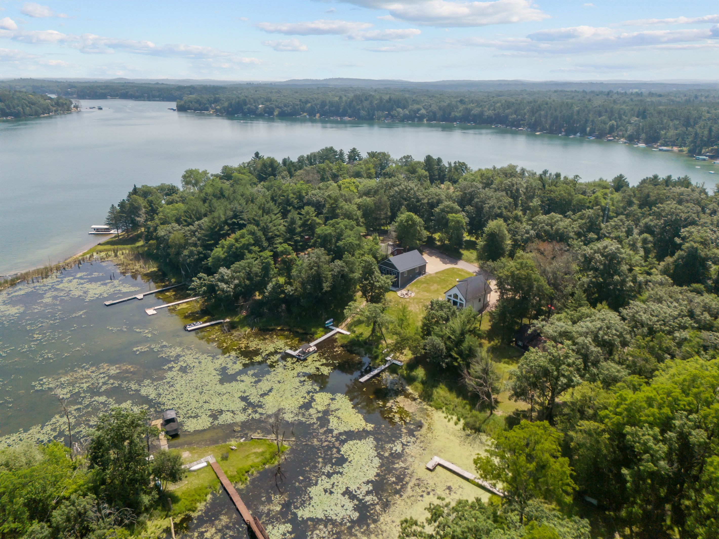 A bird’s-eye view of beautiful Long Lake in Waupaca—see the home, shoreline, and stunning lake setting all in one shot.