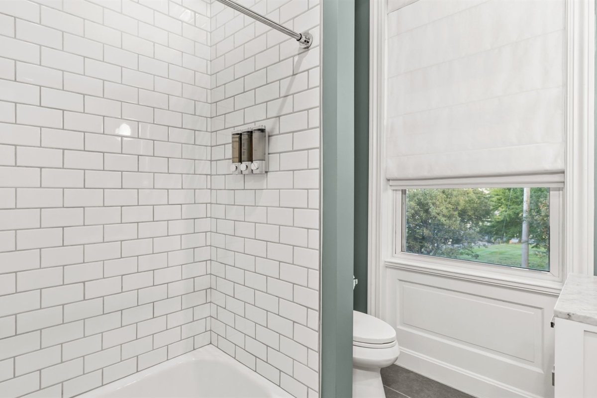 Shared bathroom upstairs provides shower over tub access with spa-like body wash, shampoo, and conditioner to help you relax after a long day or infuse you with energy for the day to come!