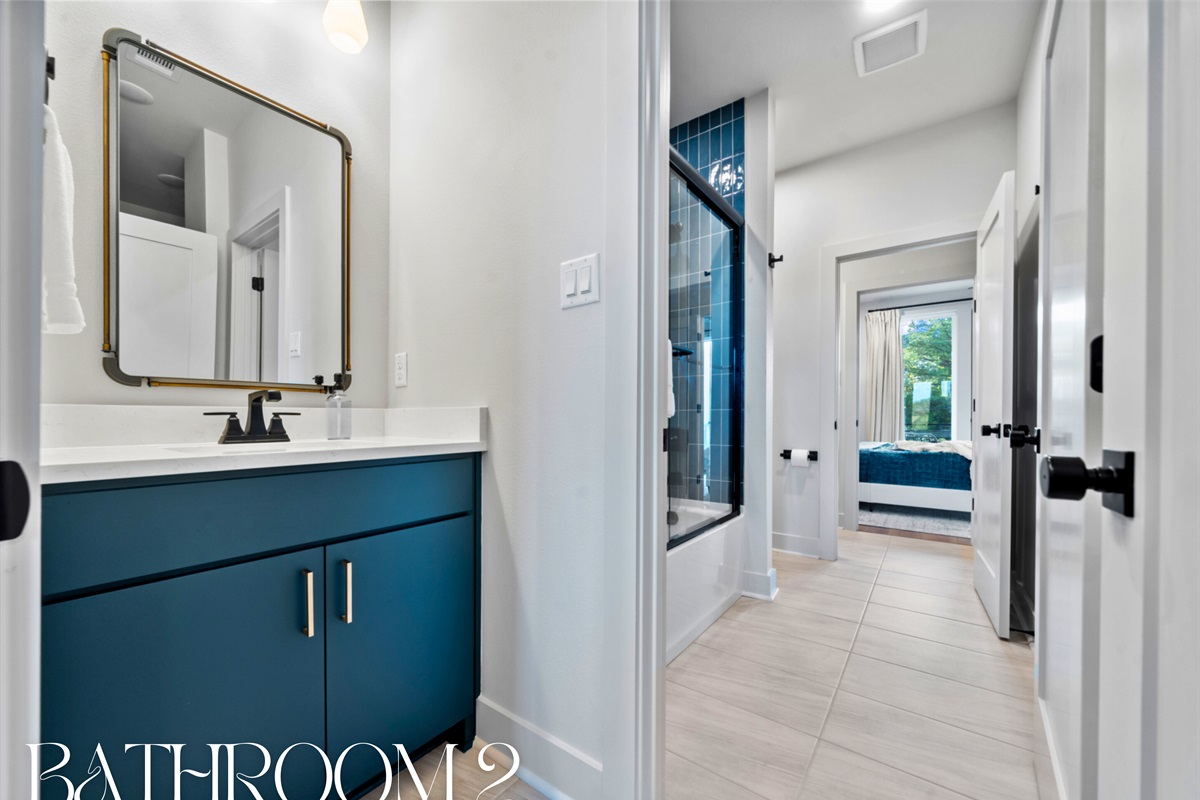 This sleek Jack n Jill bathroom combines style and functionality, making it easy to get ready with a little extra luxury.