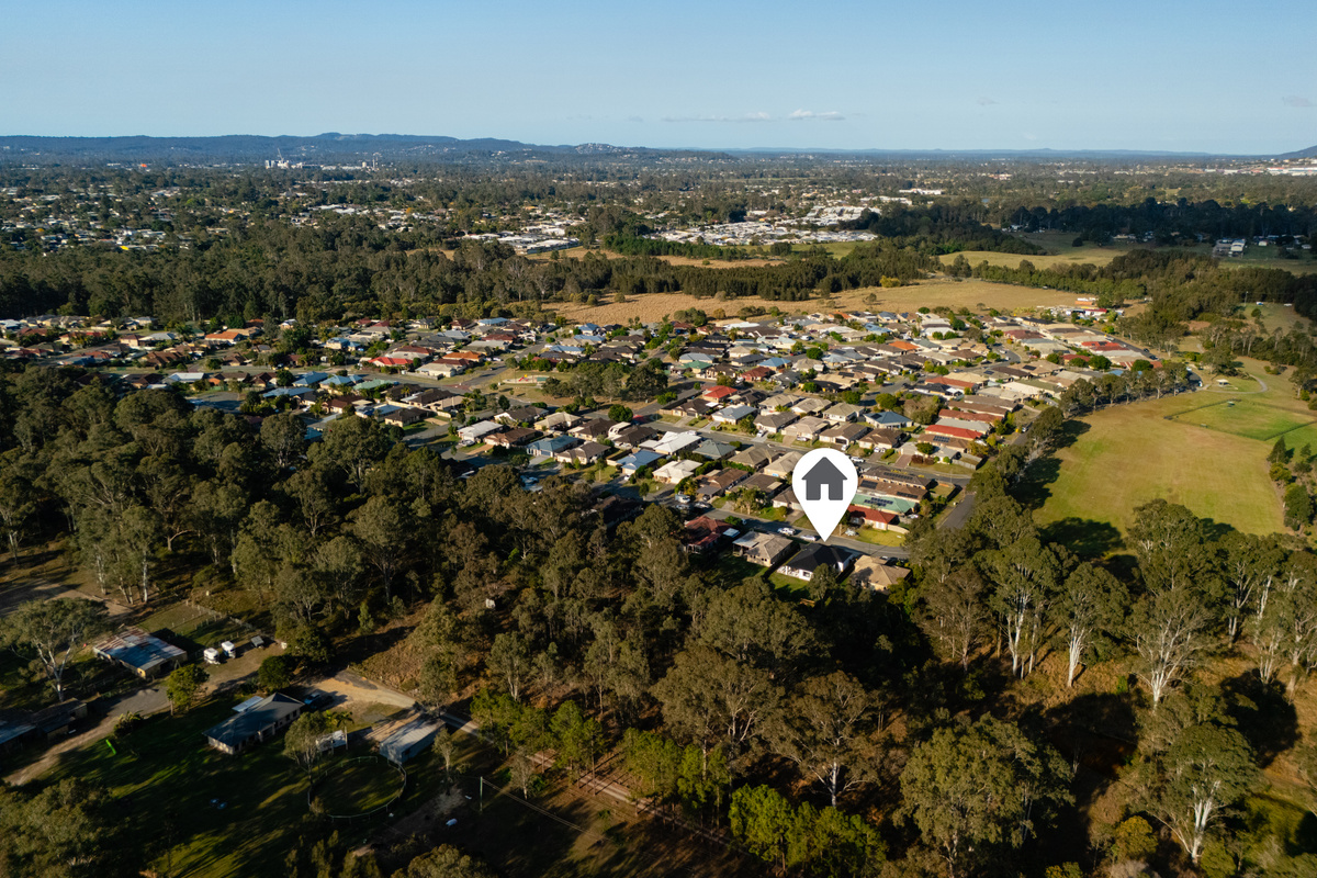 An aerial perspective of Summer’s Greenview Retreat, surrounded by greenery in a peaceful residential setting.