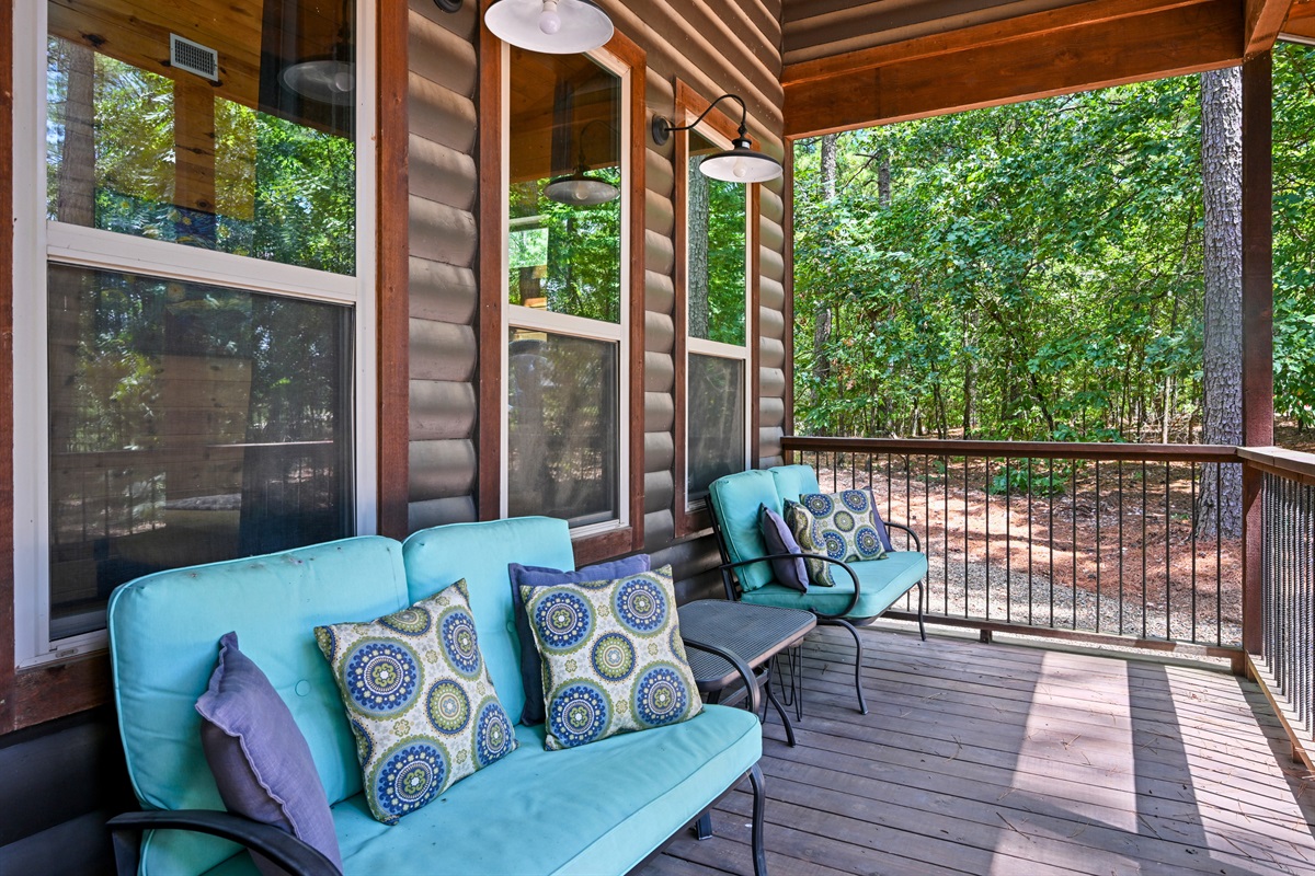 A second seating area on the porch provides a perfect place for morning chats or late-night stargazing.