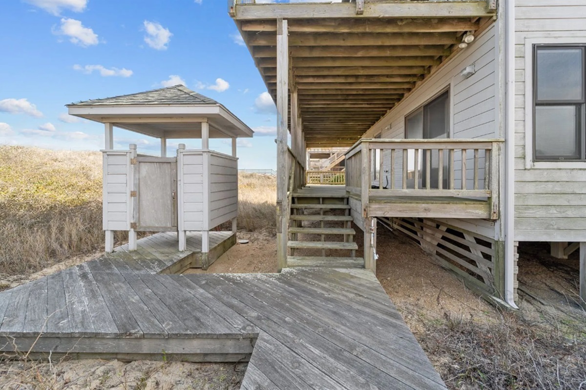 Keep your vacation house sand free with the outdoor shower and foot sprayer to rinse off after enjoying the private beach
