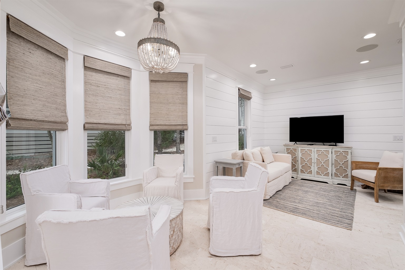 Beautiful lounge area boast 4 linen chairs.