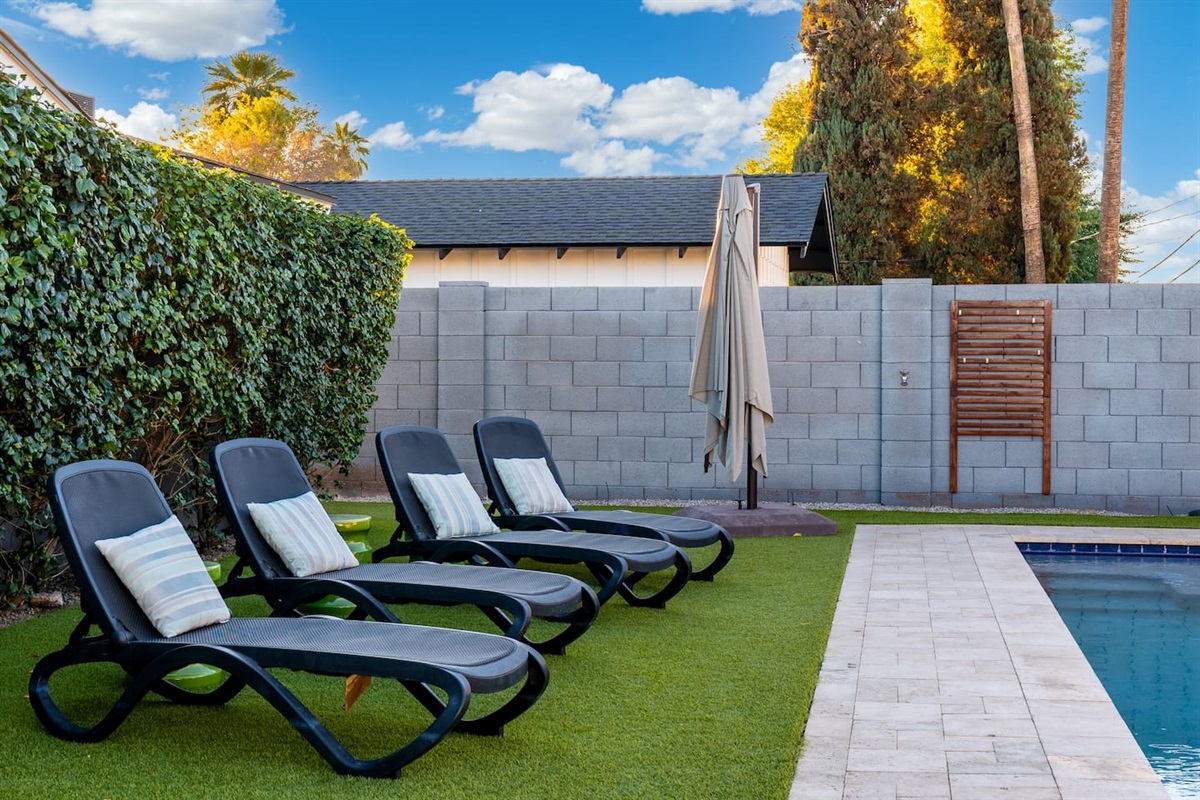 Poolside chairs designed for ultimate relaxation, perfect for soaking up the sun and getting a perfect tan.