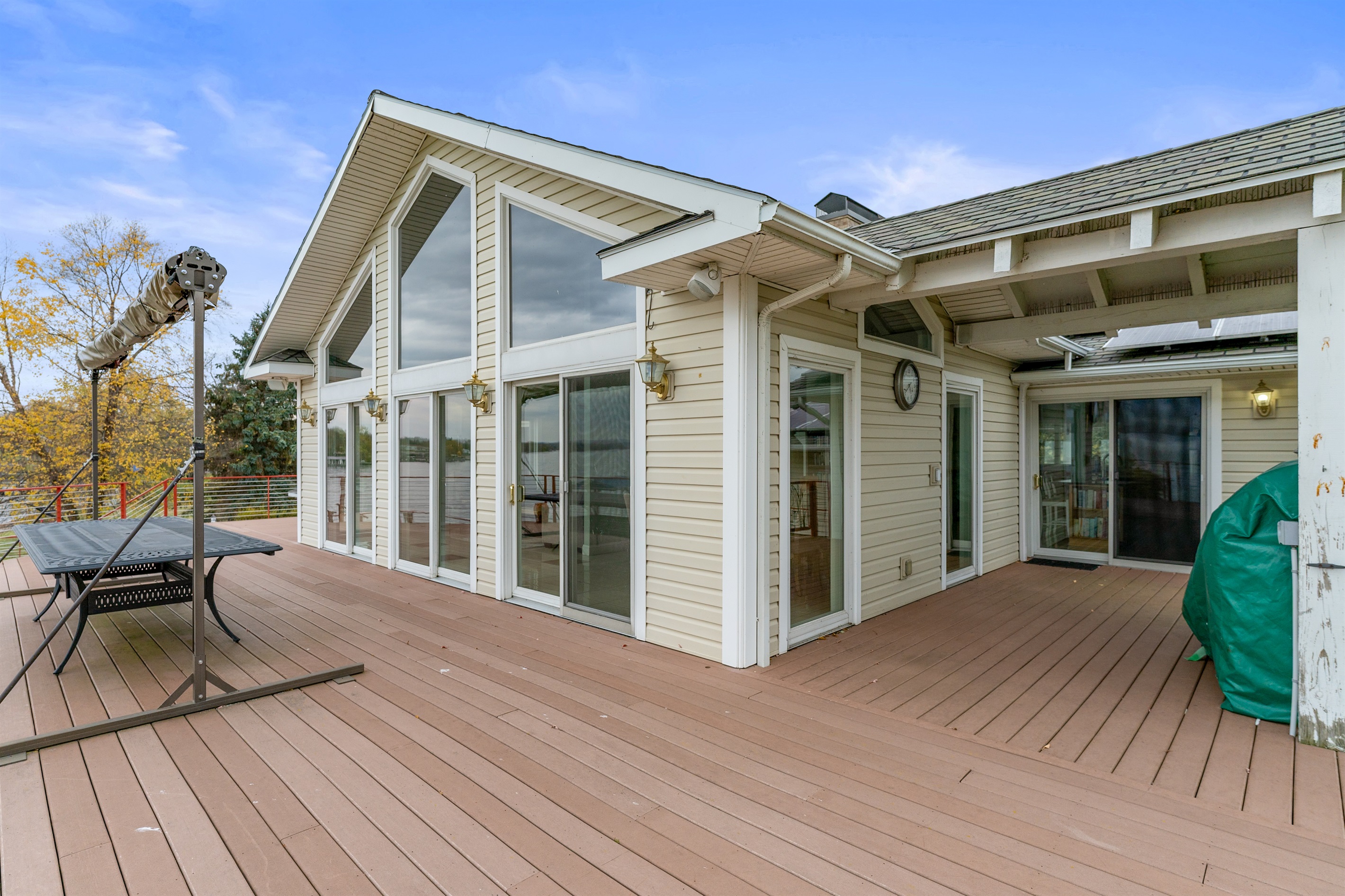 Large outdoor table for alfresco dining with sun shade for convenience
