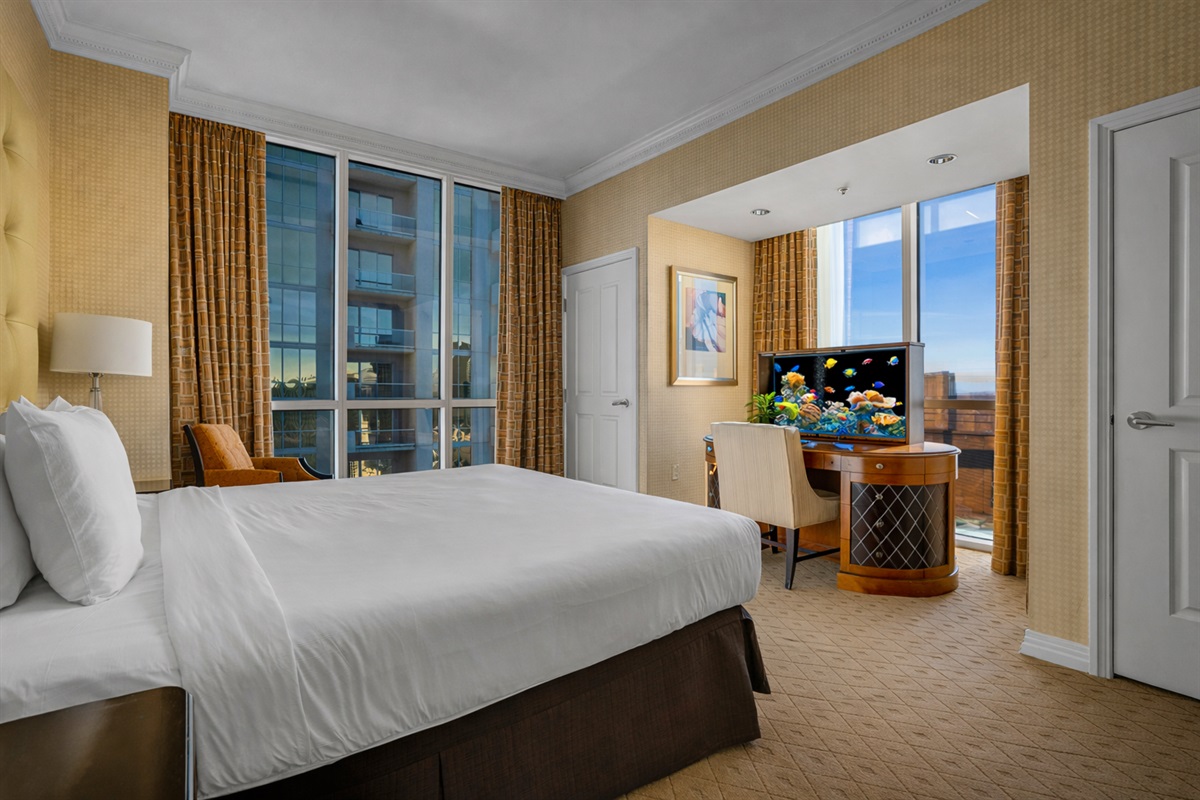 Drift off in total comfort! Cozy king bed with stunning city views right from your pillow.