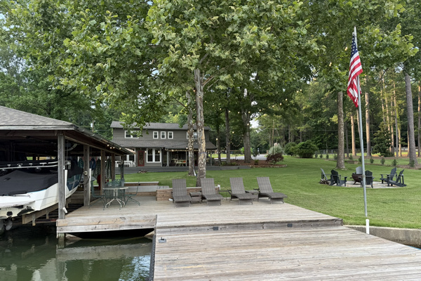 Comfortable lounge chairs under shade trees