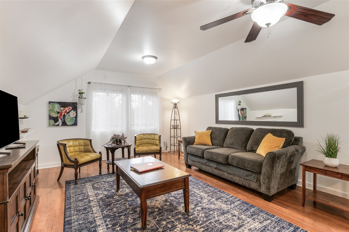 Charming upstairs unit with tall sloped ceiling