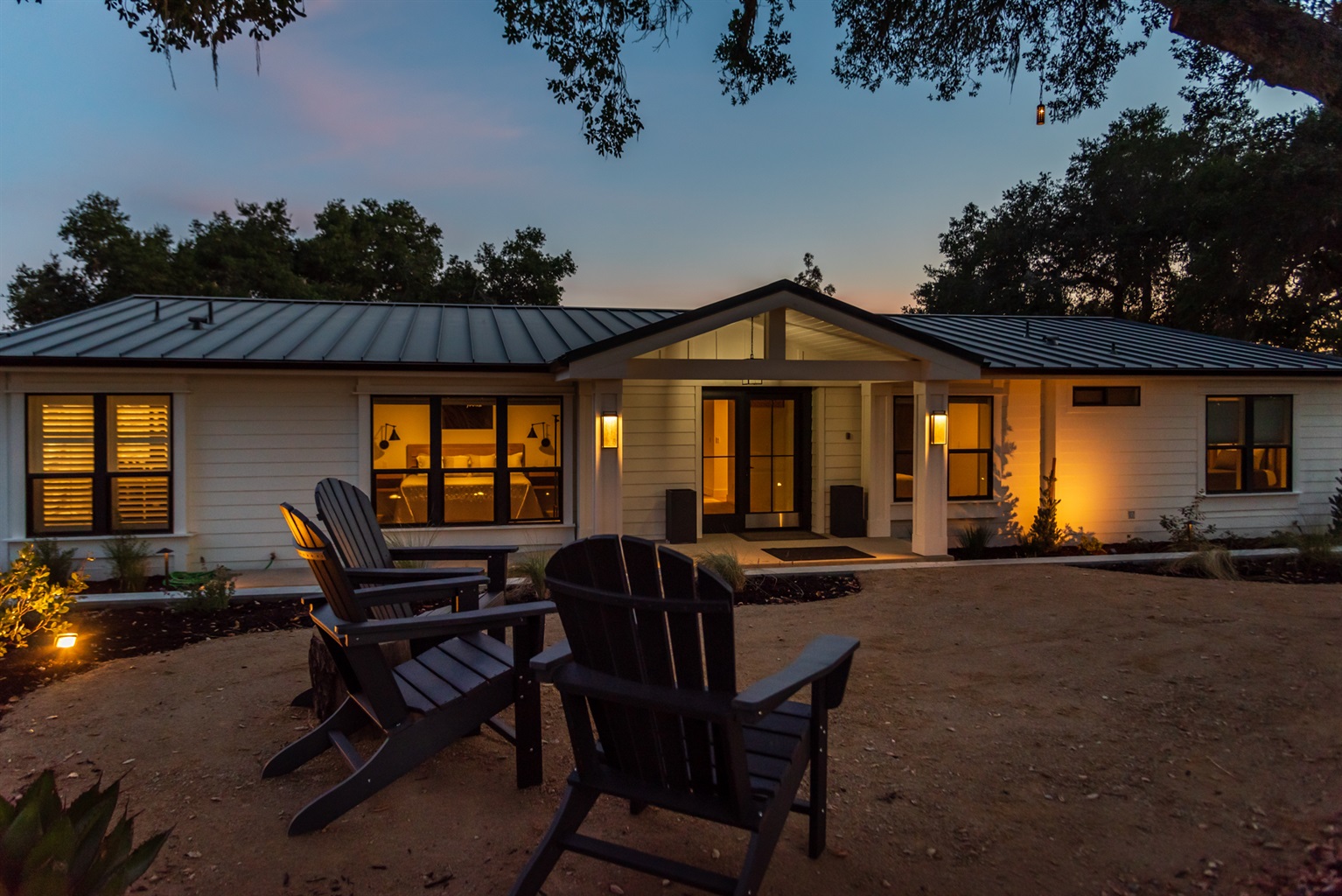 An inviting exterior glow creates a serene evening retreat under the stars.