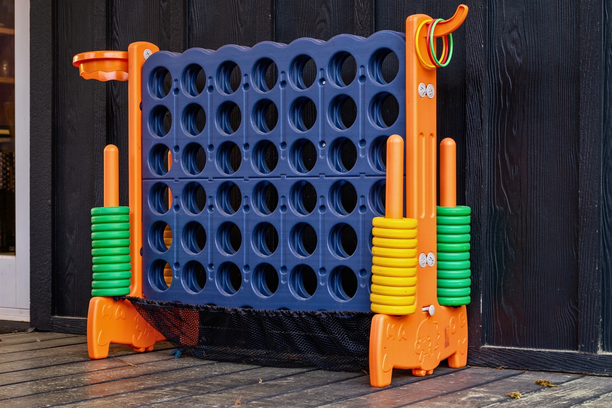 A giant connect four game adds a playful and interactive element, giving everyone something fun to enjoy together.