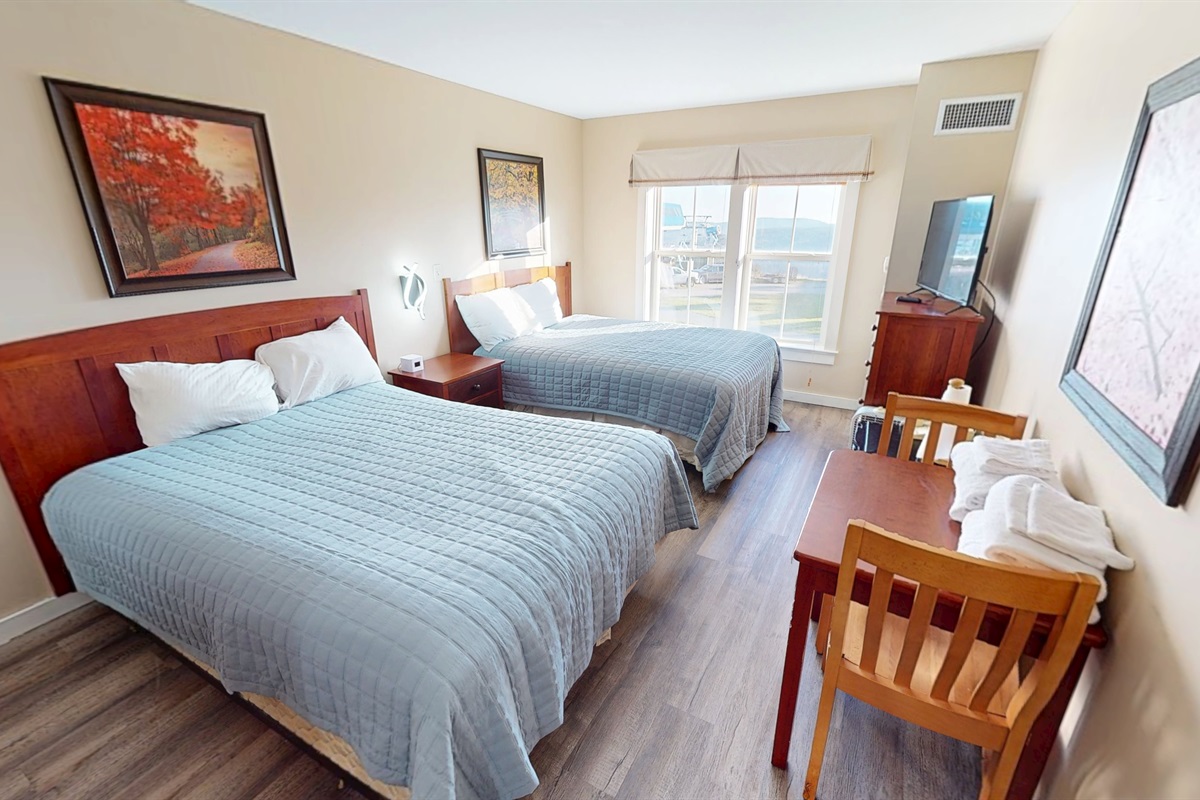 Second bedroom with two comfy beds—great for families or friends.