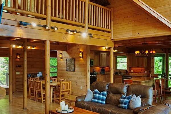 Living Room: Sunlit space with rustic charm, perfect for relaxation and laughter with friends and family!