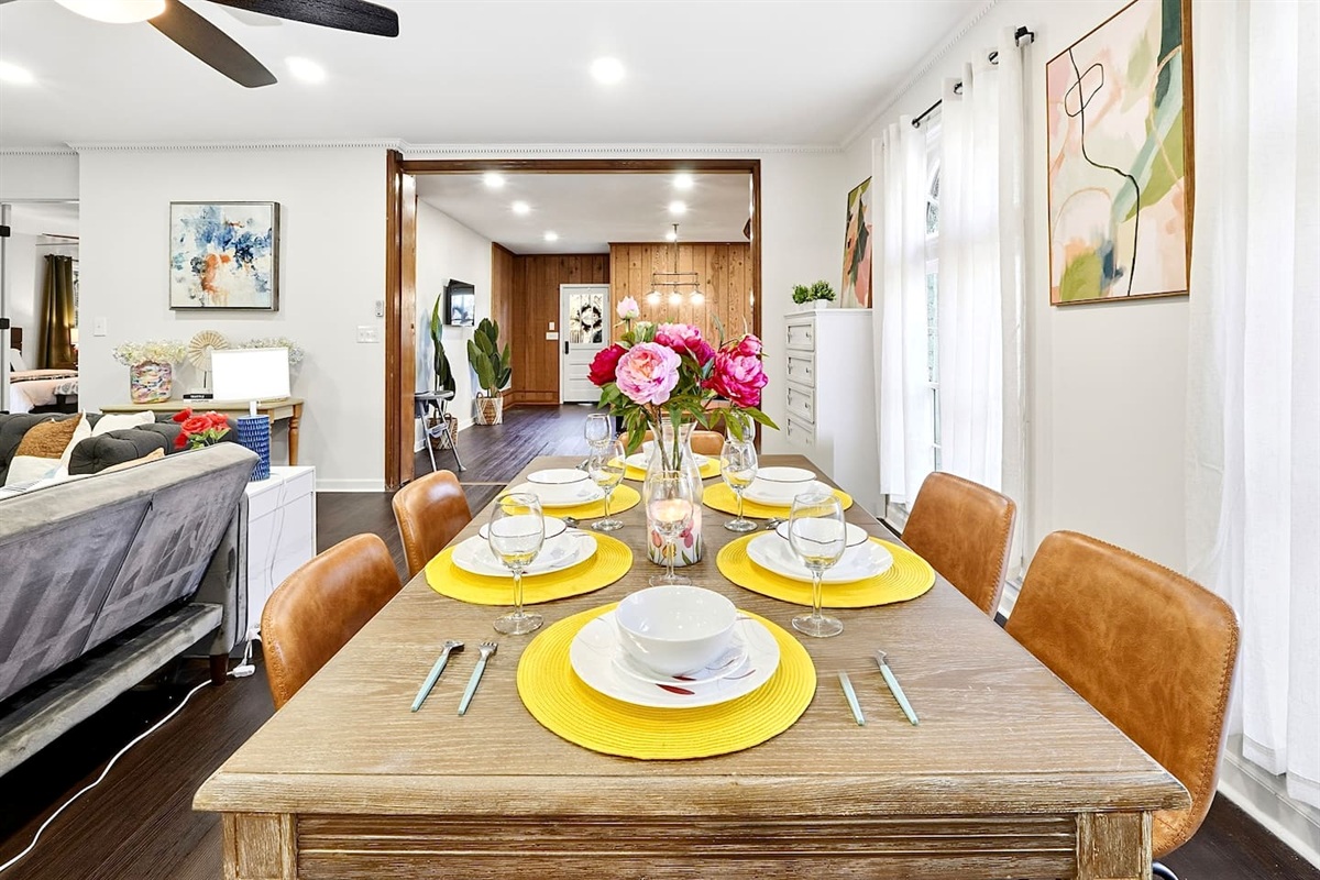 Charming wooden dining area comfortably seating up to 6 guests. Perfect for sharing meals, laughs, and creating lasting memories.