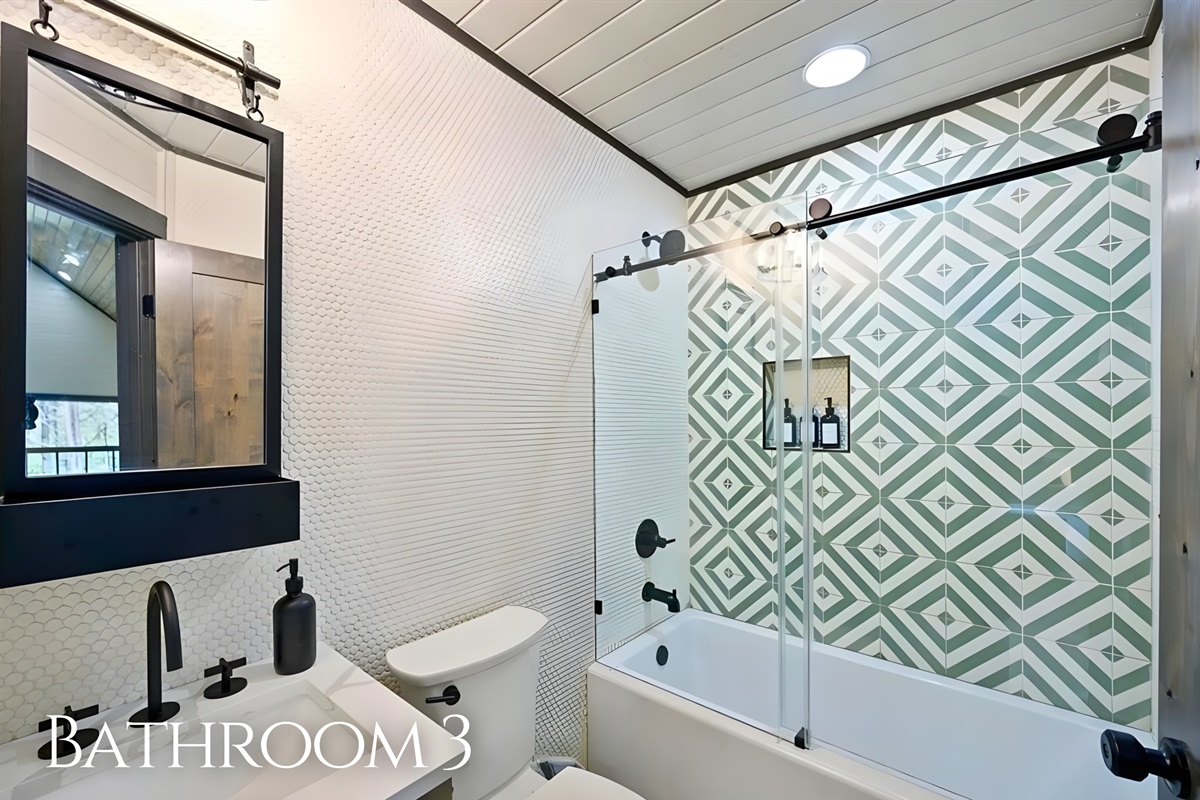 This additional bathroom keeps everyone comfortable with its bright design and practical layout.