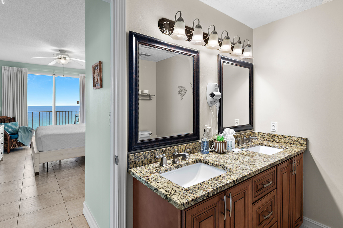 Spacious master bedroom features a King bed, Gulf views, balcony access, SMART TV w/ cable access, bathroom with dual vanity and shower/tub combo, and large closet.