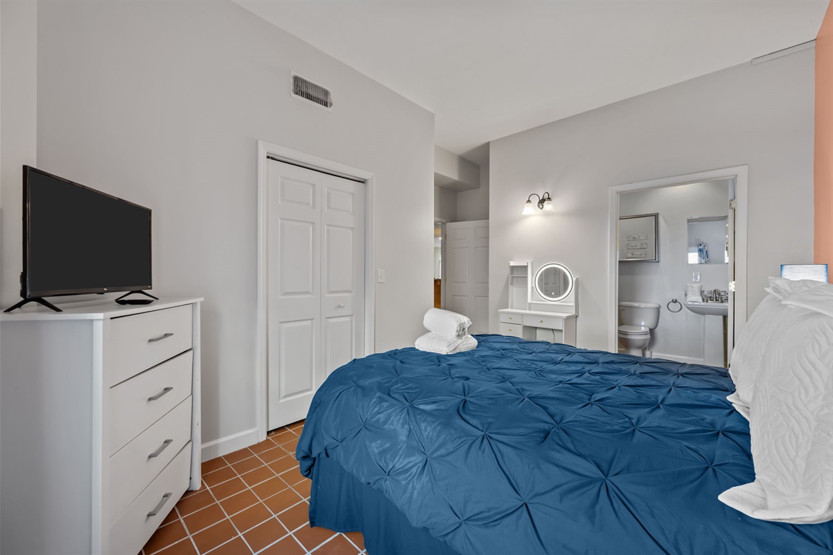 Master bedroom with ensuite bath vanity and generous storage