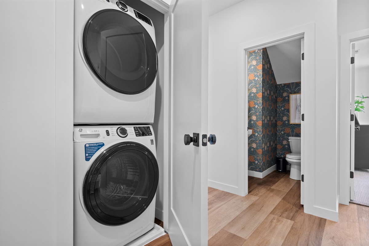 Stacked washer and dryer for easy access during your stay