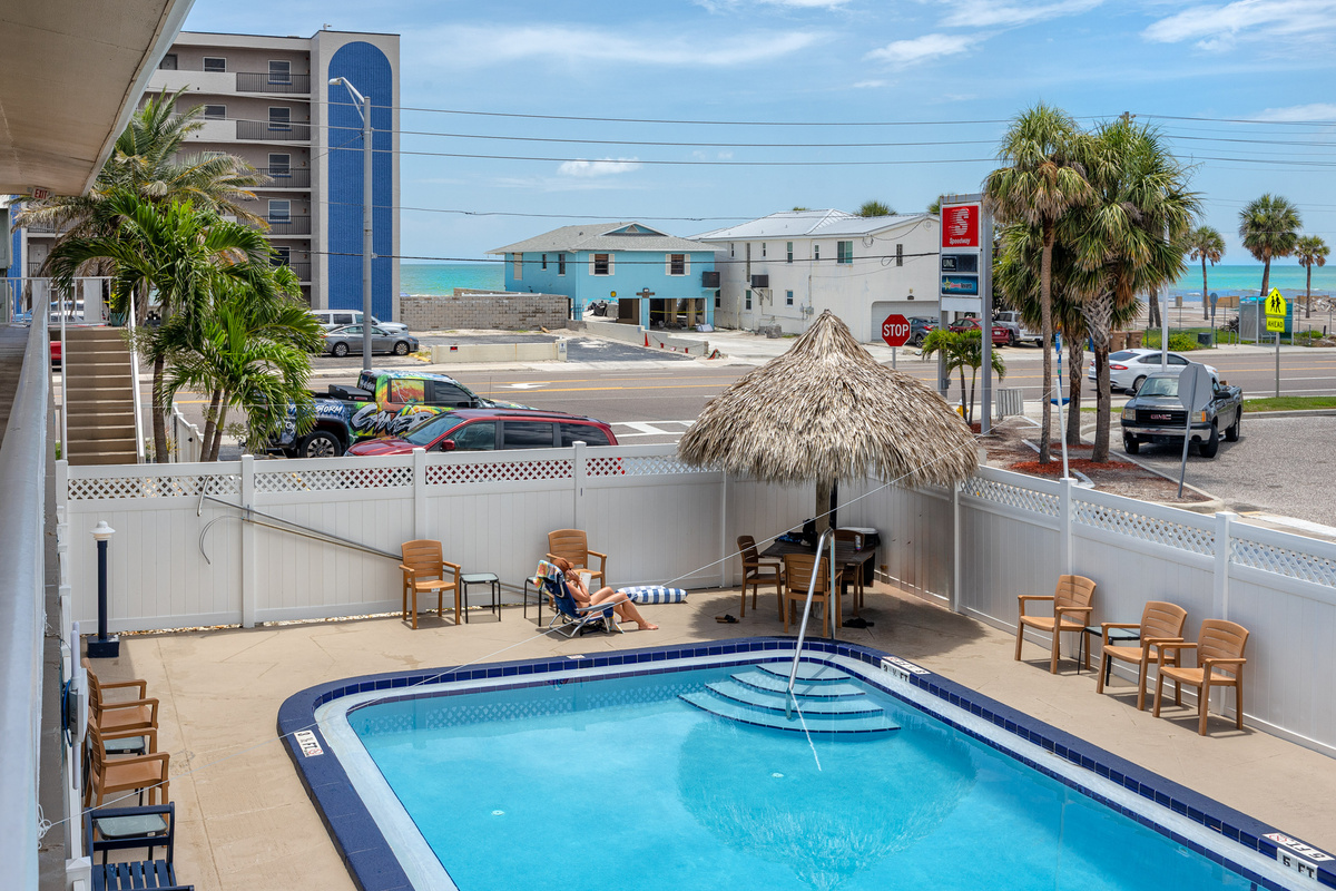 Sparkling pool right across from the beach!