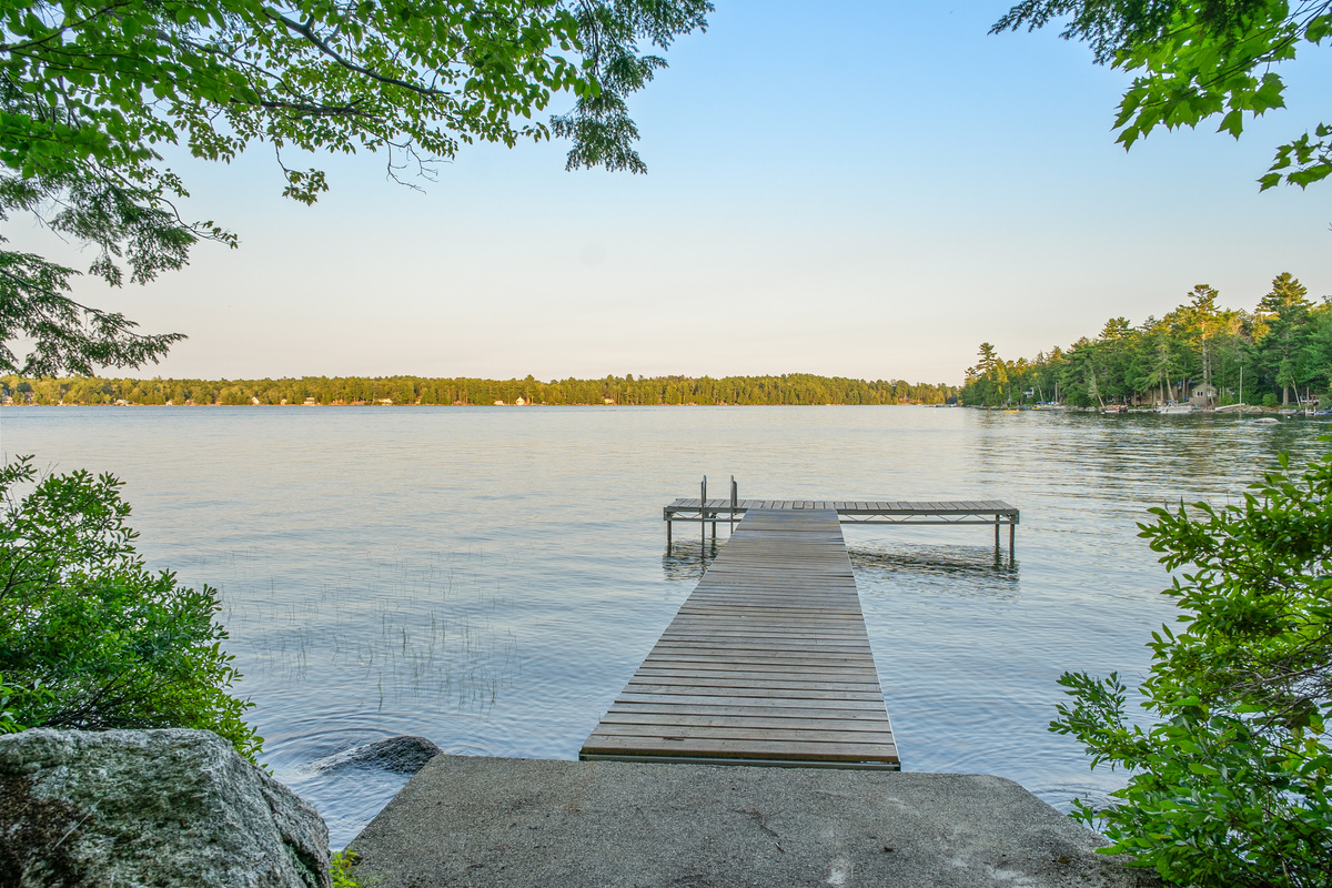 Step onto your private T-dock on Beech Hill Pond at Loonrise Point! Features a concrete landing pad, wooden plank walkway, and swim ladder. Perfect spot to dock your boat, fish for trophy trout, or swim in clear Otis, ME water!