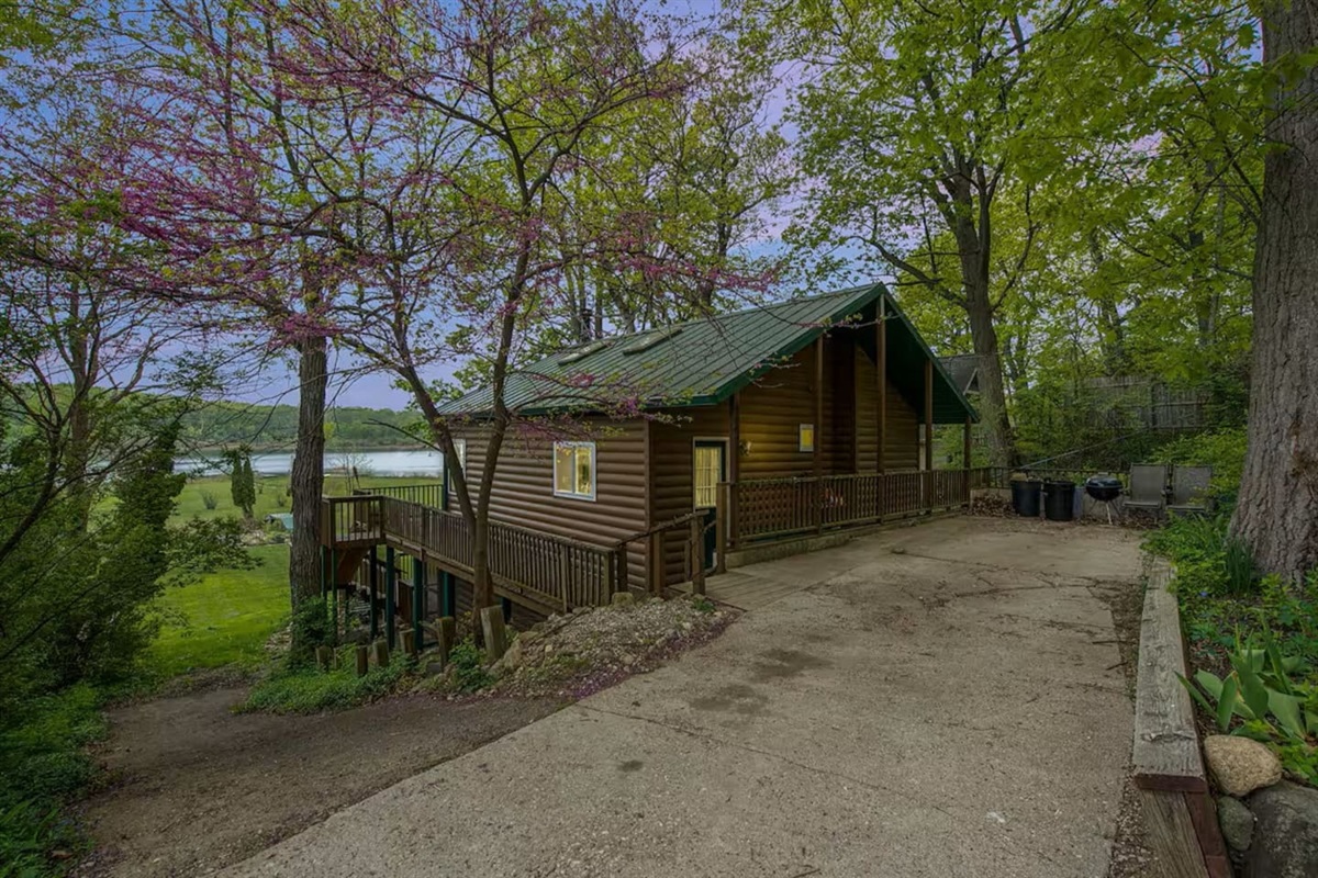 Front view of the rustic Cabin. Secluded charm with private parking area. More parking across the road as well.