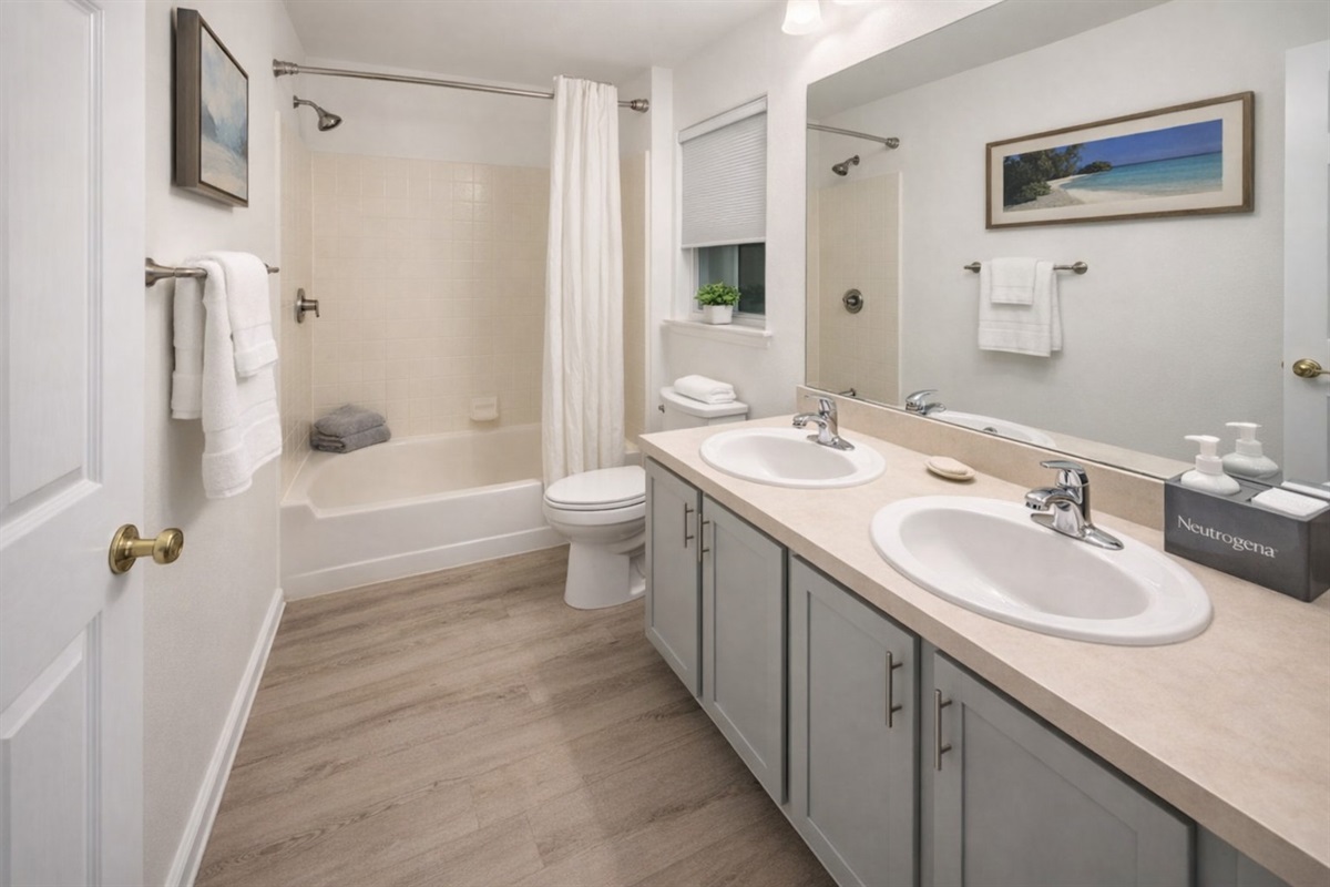 Master En-suite bathroom with double sink and step in shower 