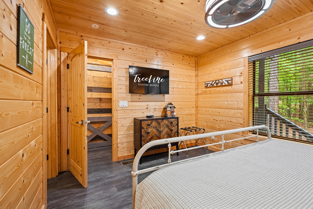 Another view of this cozy sleeping space keeps things simple and inviting, giving guests a quiet place to rest at the end of the day.