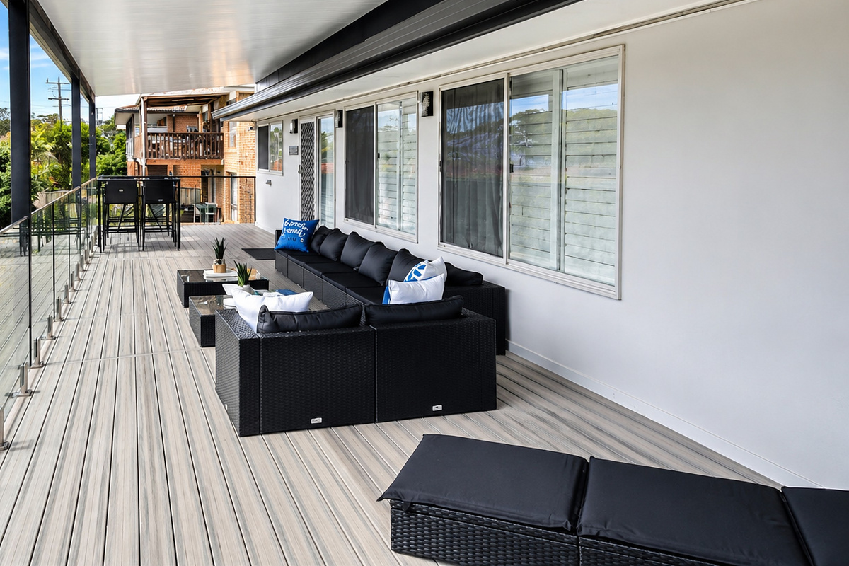 The upstairs front balcony adds one of Skye’s Beach House’s key outdoor areas, positioned toward the Malua Bay Beach side of the property.