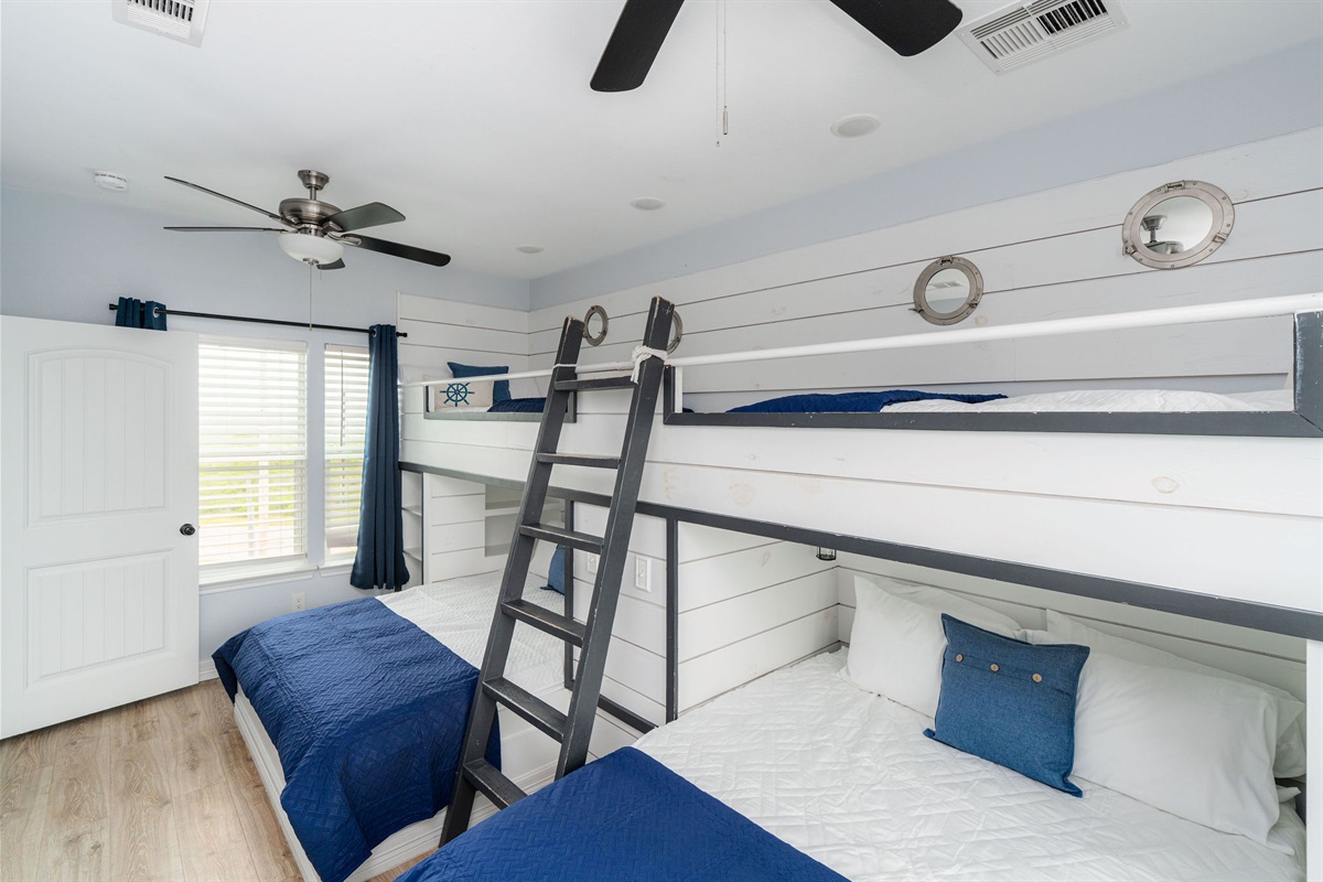 Bunk Room alt (upstairs) — nautical details, sleeps up to 6. Kids own this floor.