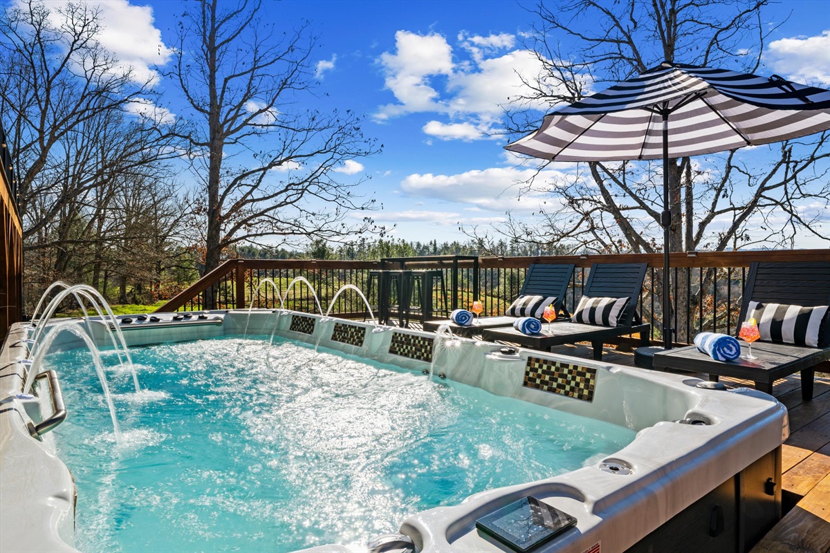 {Swim Spa Pool} An 18-ft swim spa heated up to 104° or chilled to 37° for cold plunges — with jets and built-in seating, perfect for relaxing, recharging, or taking in the views year-round.
