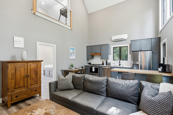 Relax on the comfortable sectional while staying connected to the kitchen and dining spaces.