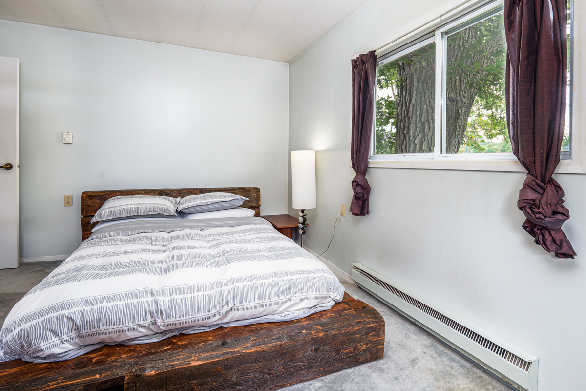 Simple guest bedroom with bright natural light