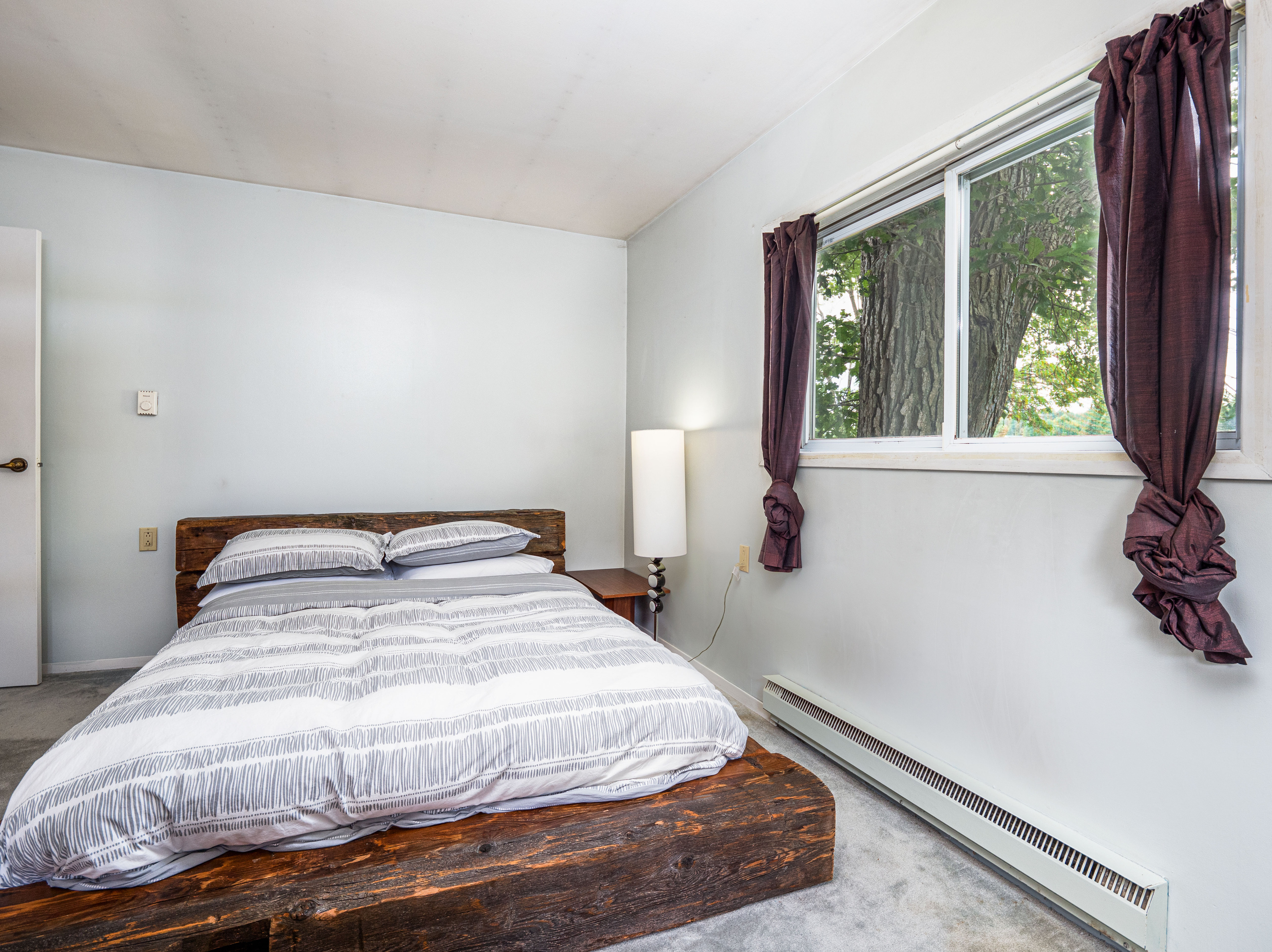Simple guest bedroom with bright natural light