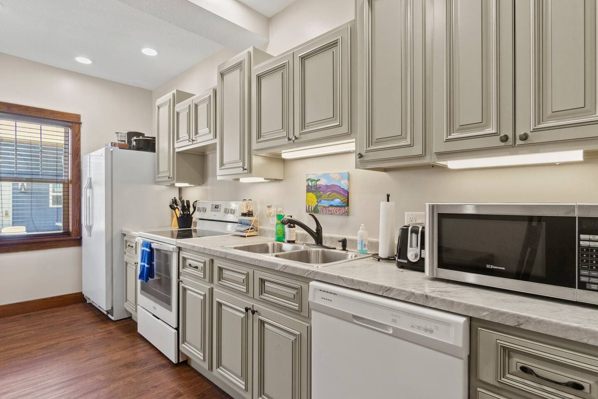 Fully equipped kitchen with modern appliances, ample counter space, and plenty of storage for a seamless cooking experience.