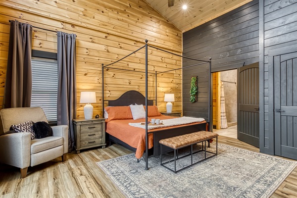 Fall asleep beneath cozy canopy linens and wake to the peaceful glow of the mountains