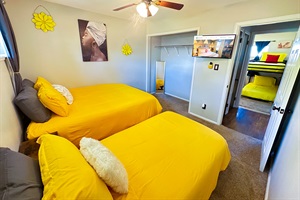 Double the Comfort, Double the Fun – Our bedroom boasts two single beds, a smart TV, and a spacious closet for a delightful stay.