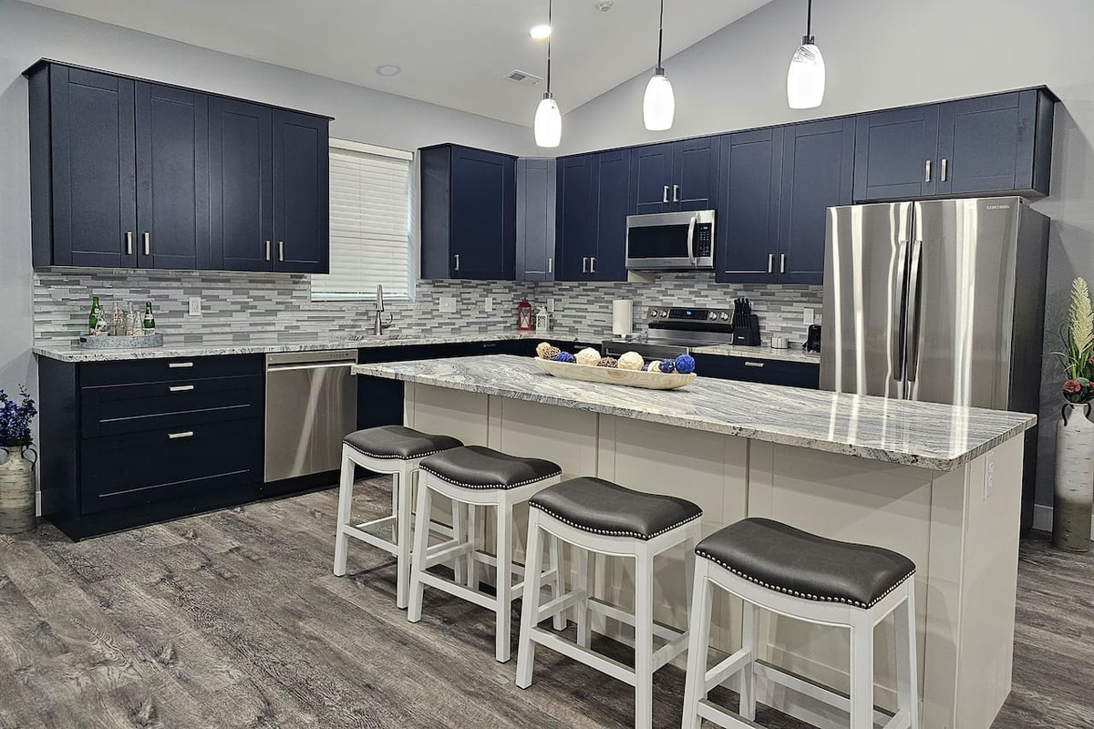 Chef‑ready kitchen with modern appliances and plenty of prep and seating space.