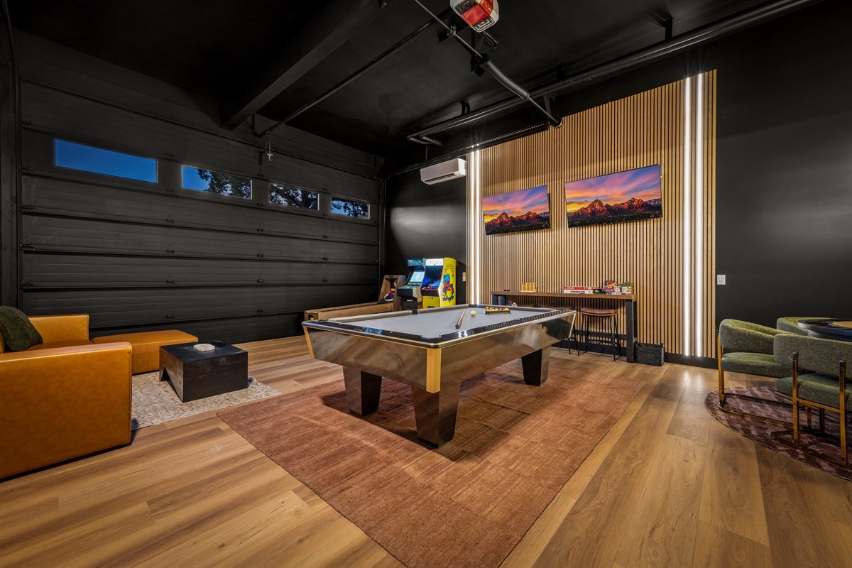 Downstairs Game Room:
Arcade games, shuffleboard, and hangout space for all-day entertainment.