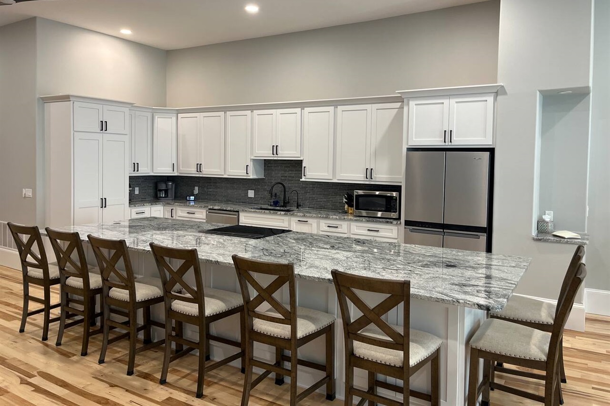 The lights are voice activated!  If you say ‘Alexa, turn on the kitchen lights’ she will turn them on for you.  You can also ask her to dim the lights or turn them off.  For a complete list of Alexa controls look in the welcome book.