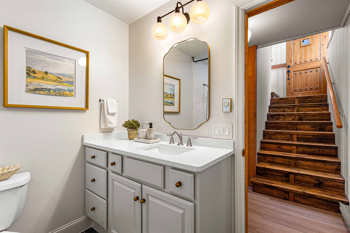 A convenient full bathroom on the lower level of the new side of the home, located just outside the Bear and Duck Rooms. Since the Bear Room has its own ensuite, this bathroom primarily serves guests staying in the Duck Room and nearby common areas.