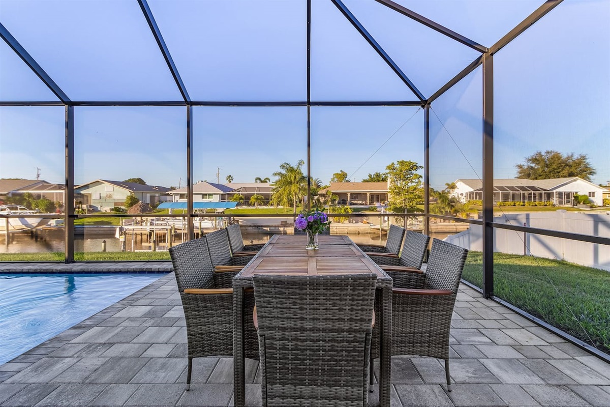 Enjoy outdoor dining with a spectacular pool and water views!