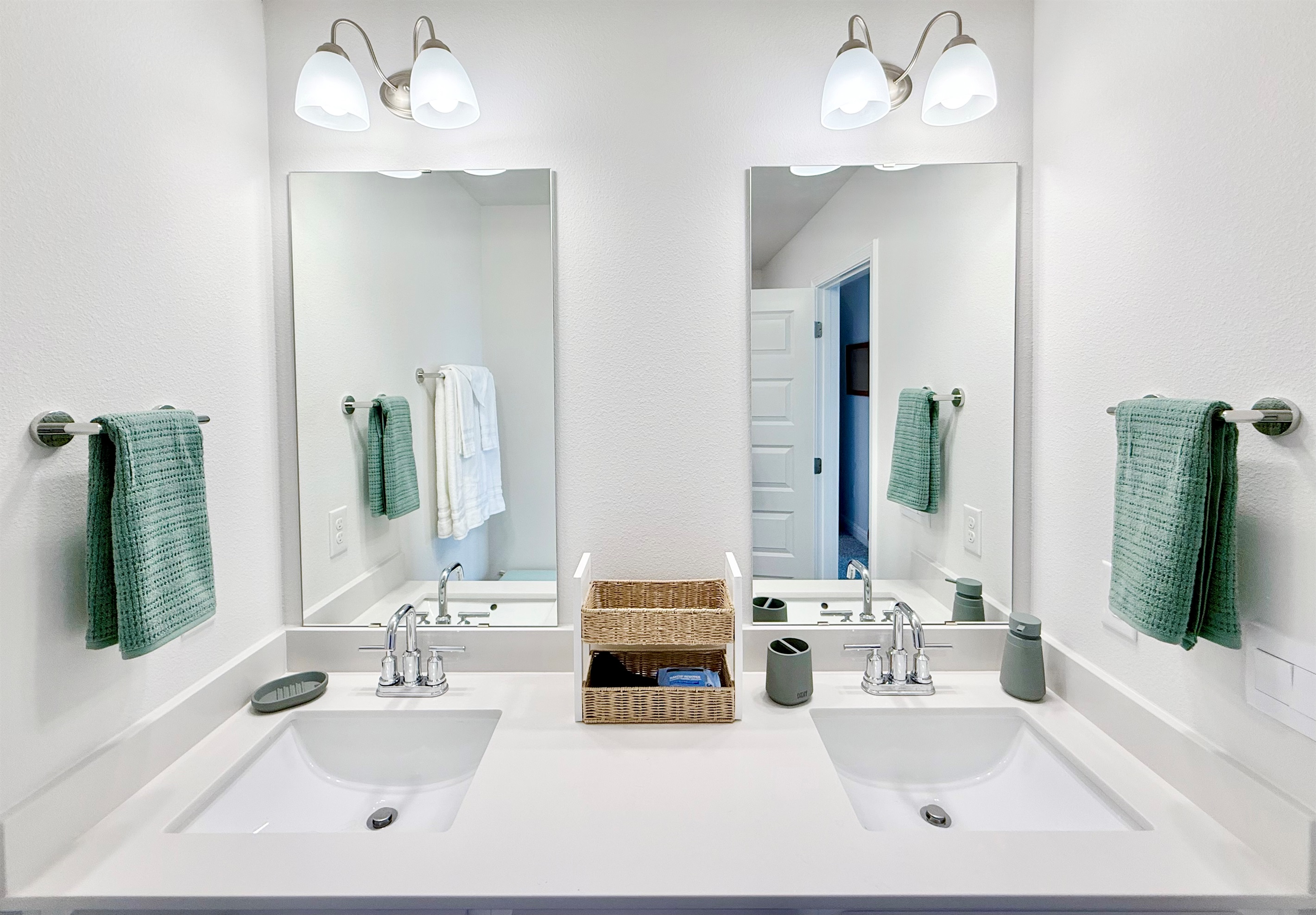 Primary bathroom with dual vanities. A selection of toiletries is provided by us